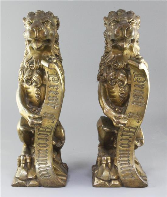 A.W.N. Pugin for Alton Towers. A pair of heavy gilt bronze fire dogs modelled as lions triumphant, c. 1840-50, height 19in. A.W.N. Pugin for Alton Towers. A pair of heavy gilt bronze fire dogs modelled as lions triumphant, c. 1840-50, height 19in.