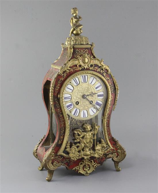 An early 20th century ormolu and red boulle Louis XVI style mantel clock, 19in. An early 20th century ormolu and red boulle Louis XVI style mantel clock, 19in.