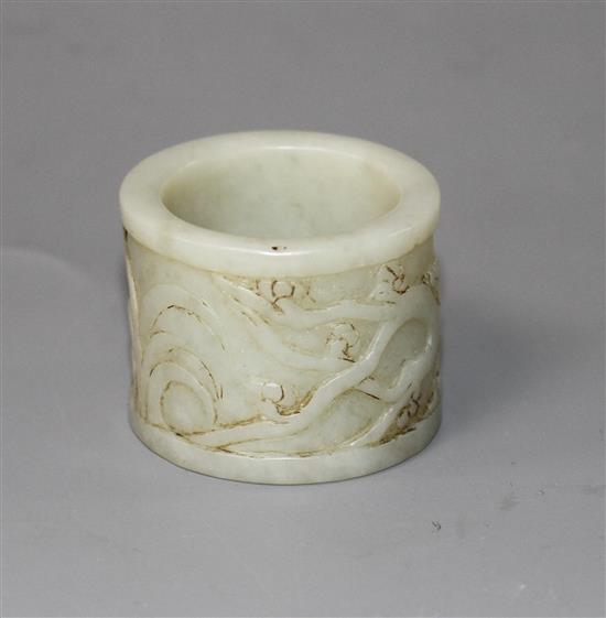 A Chinese pale celadon jade archers ring, 17th/18th century,