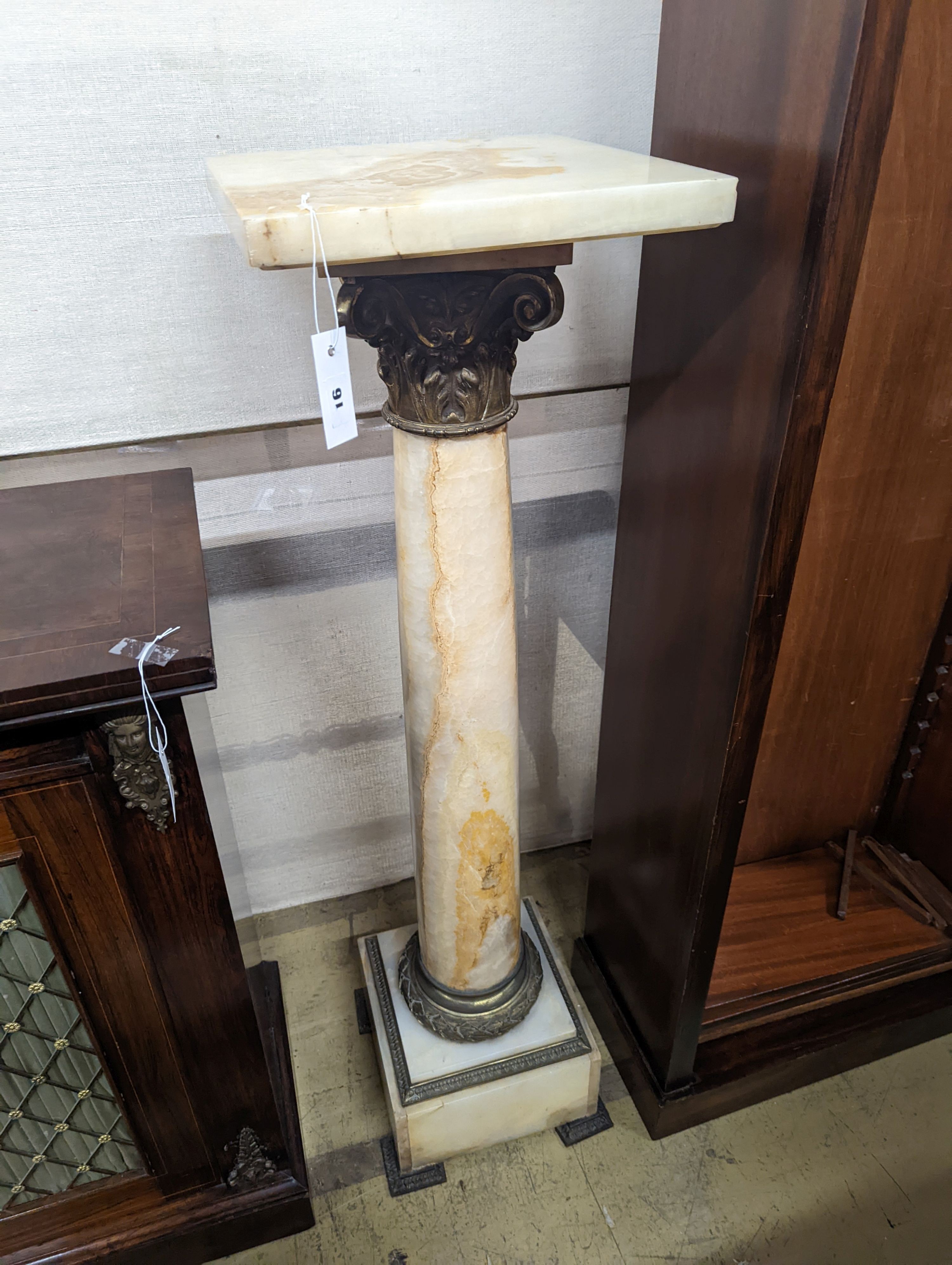 An early 20th century gilt metal mounted onyx pedestal, height 119cm