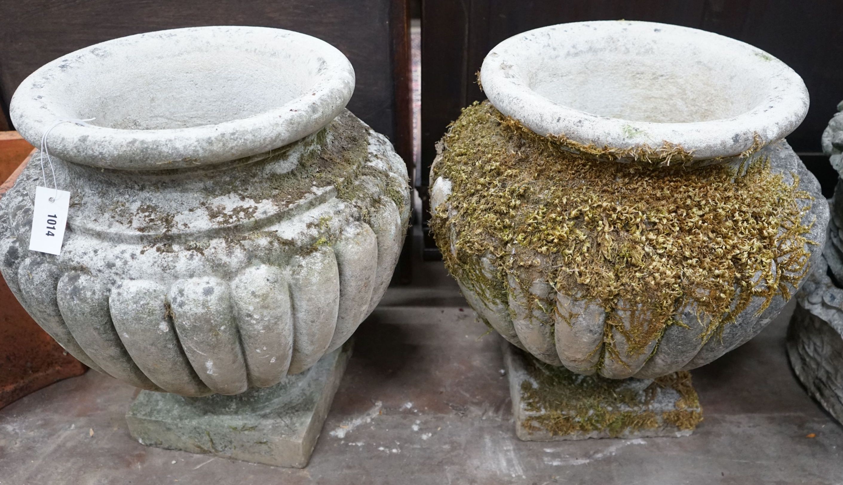 A pair of circular reconstituted stone garden planters, diameter 54cm, height 56cm