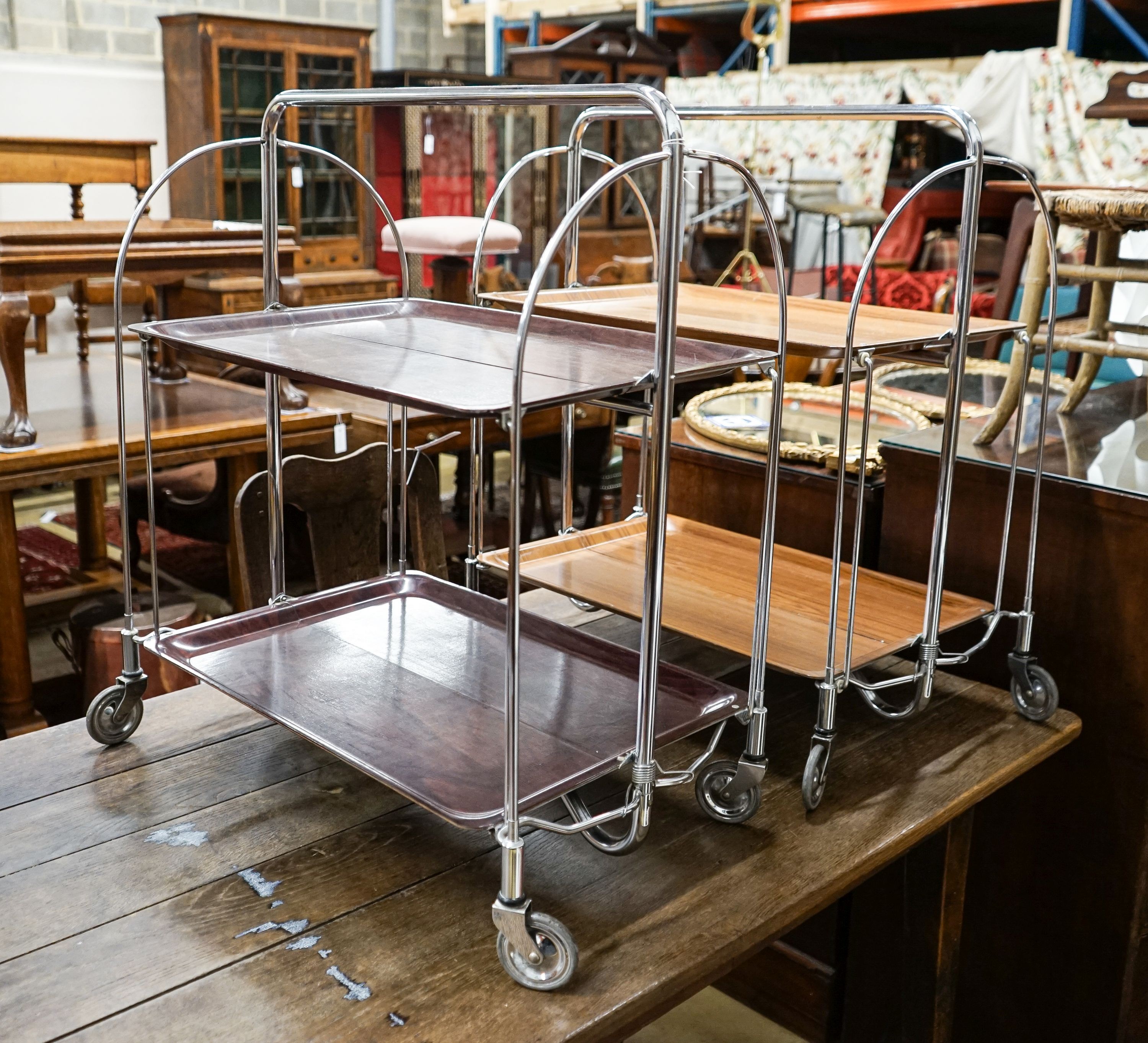 Two mid century Gerlinol Breshley Dinett chrome folding tea trolleys, length 66cm, depth 41cm, height 78cm