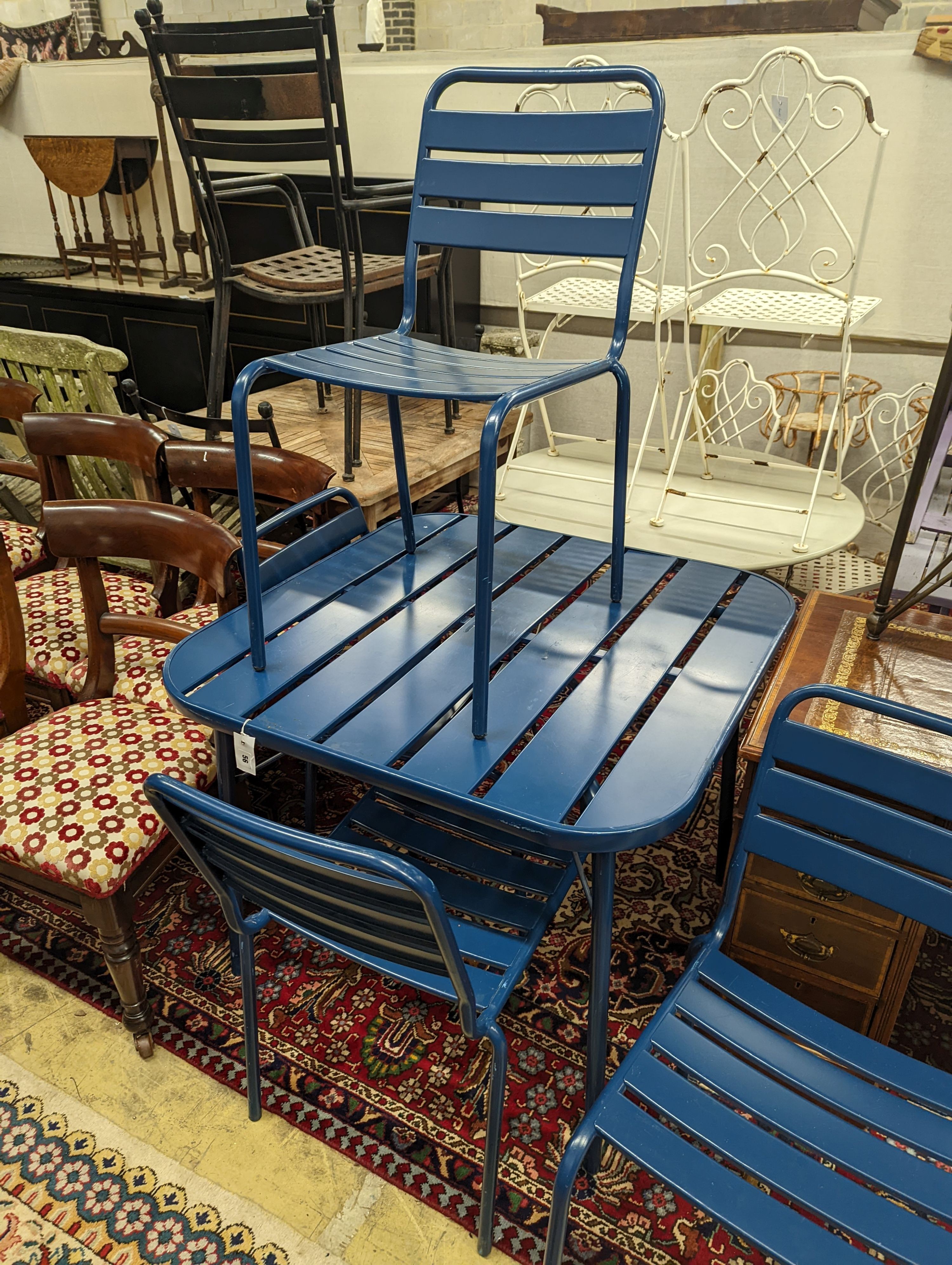 A square painted metal garden table, width 90cm, height 74cm and four matching chairs