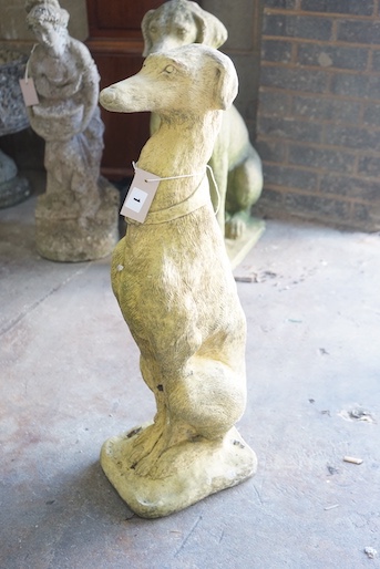 A reconstituted stone figure of a seated greyhound, height 76cm