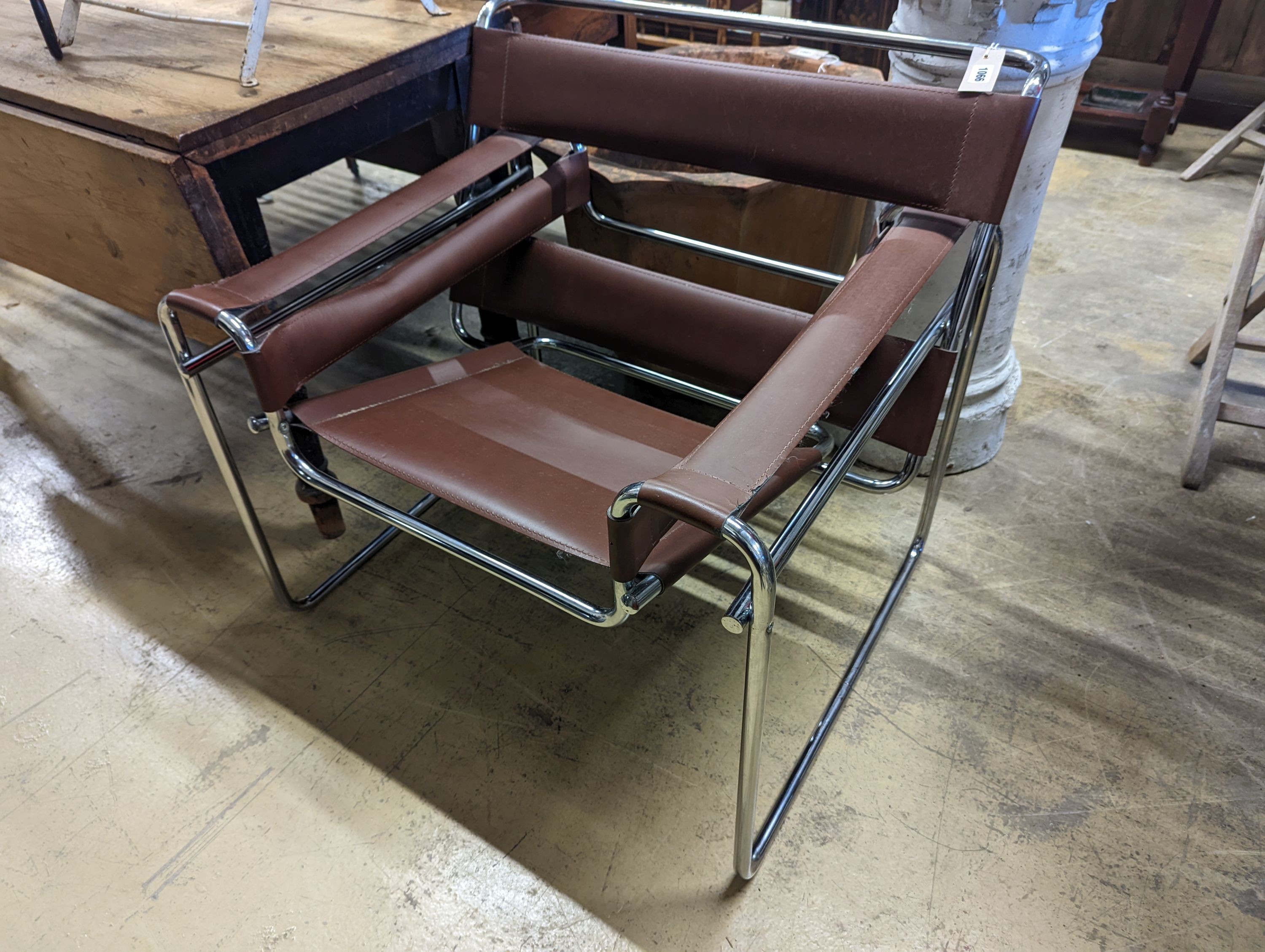 A Wassily style brown leather and chrome lounge chair, width 78cm, depth 68cm, height 75cm
