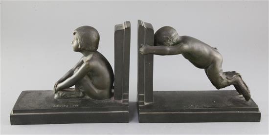 Paul Silvestre (French 1884-1976). A pair of early 20th century patinated bronze bookends, Susse Freres, Paris, length 8.25in. Paul Silvestre (French 1884-1976). A pair of early 20th century patinated bronze bookends, Susse Freres, Paris, length 8.25in.