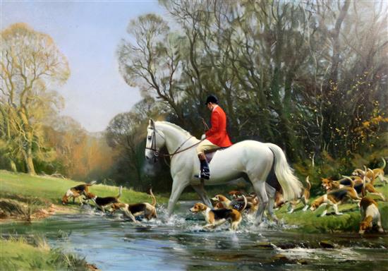 § Frank Wootton (1911-1996) Huntsman and hounds crossing a stream 28 x 40in. § Frank Wootton (1911-1996) Huntsman and hounds crossing a stream 28 x 40in.