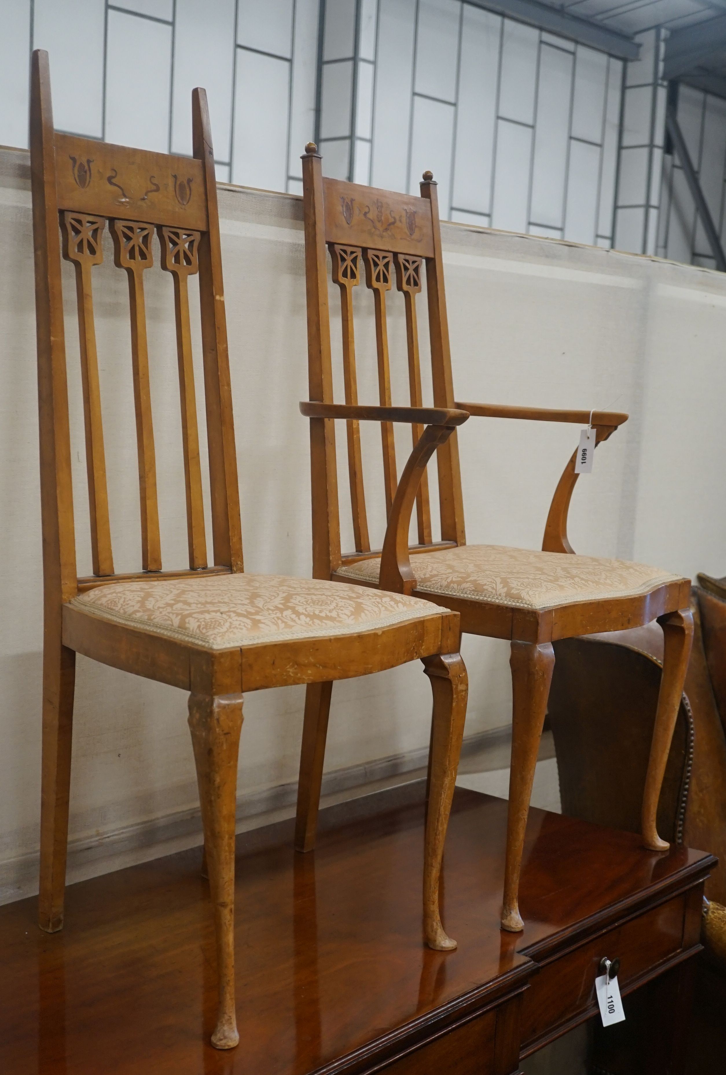 A pair of Art Nouveau inlaid mahogany chairs, one with arms