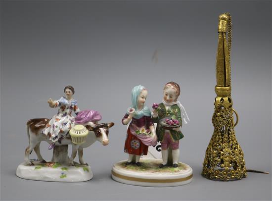 A gilt metal posy holder and a pair of German figures A gilt metal posy holder and a pair of German figures