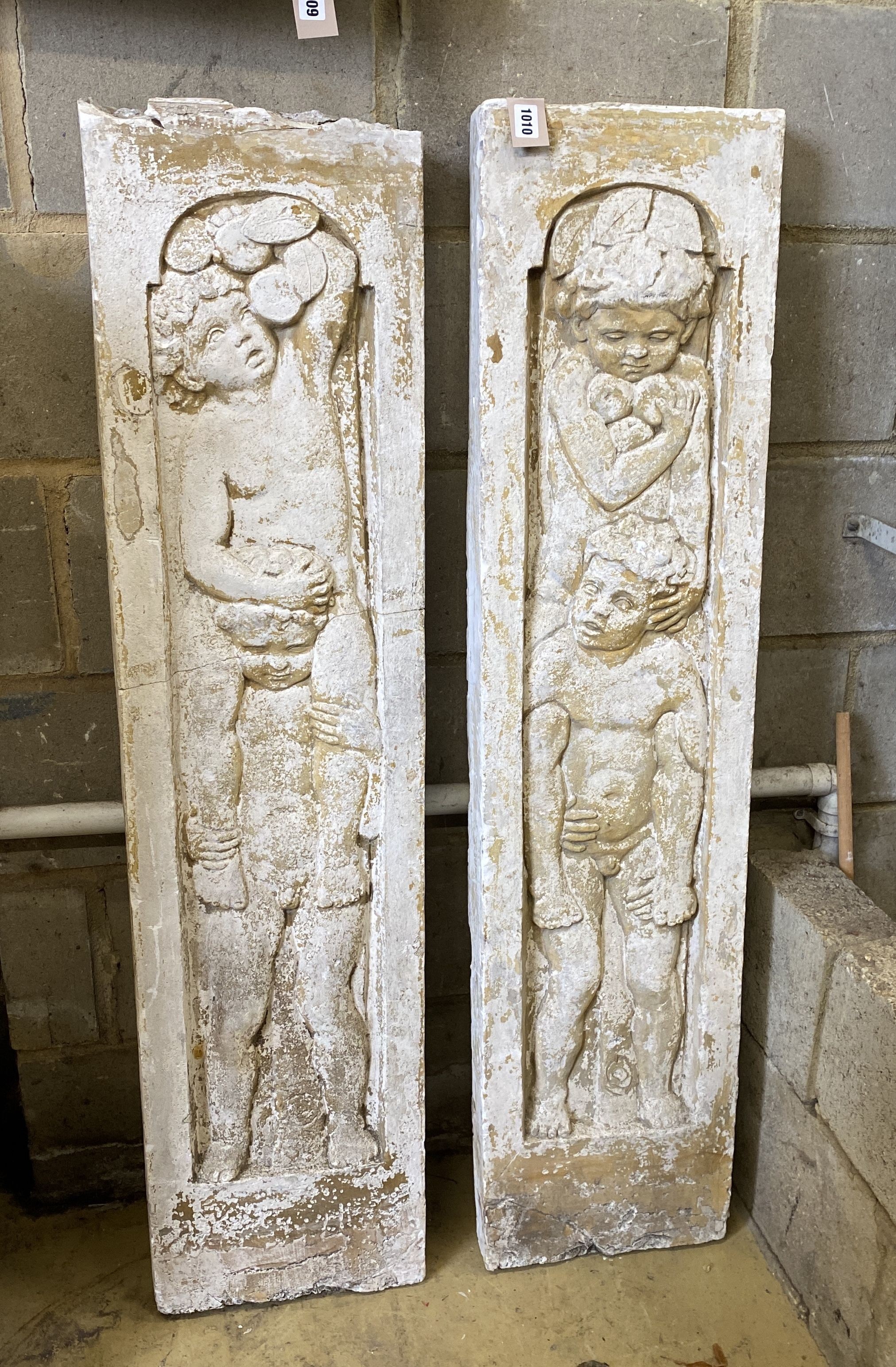 A pair of rectangular plaster putti panels, early 20th century, width 30cm, height 126cm