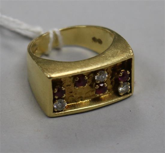 An early 1970s 18ct gold, ruby and diamond set ring, size K. An early 1970s 18ct gold, ruby and diamond set ring, size K.