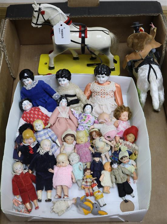 A collection of small and miniature dolls, etc.,