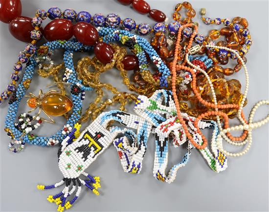 A group of assorted necklaces including simulated amber, coral, American Indian? bead and amber. A group of assorted necklaces including simulated amber, coral, American Indian? bead and amber.