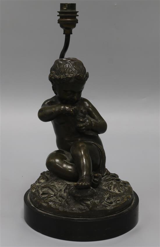 A late 19th century French bronze of a putto and dove, converted to a lamp height 33cm A late 19th century French bronze of a putto and dove, converted to a lamp height 33cm