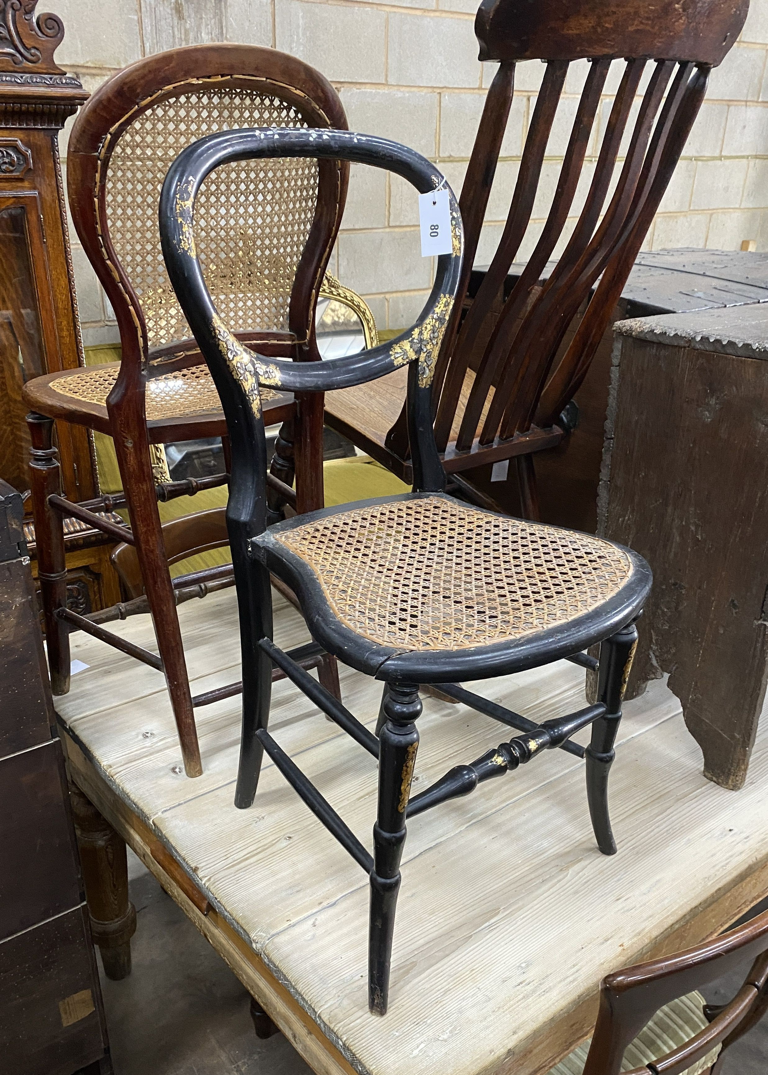 A Victorian elm and beech rocking chair together with two Victorian caned seat chairs
