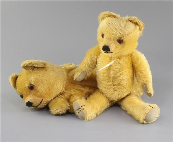 An Omega Pyjama case 1930s, Merrythought bear 1940s, tallest 14in. An Omega Pyjama case 1930s, Merrythought bear 1940s, tallest 14in.