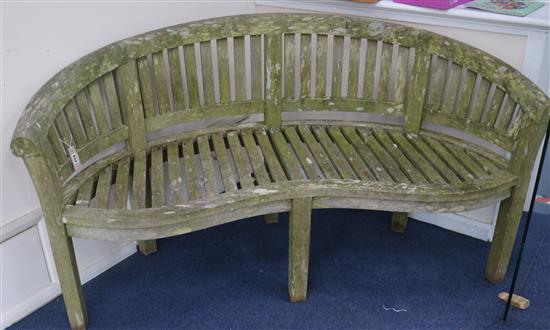 A curved garden bench, W.161cm Sale 100717 - Lot 834 - - Gorringe's
