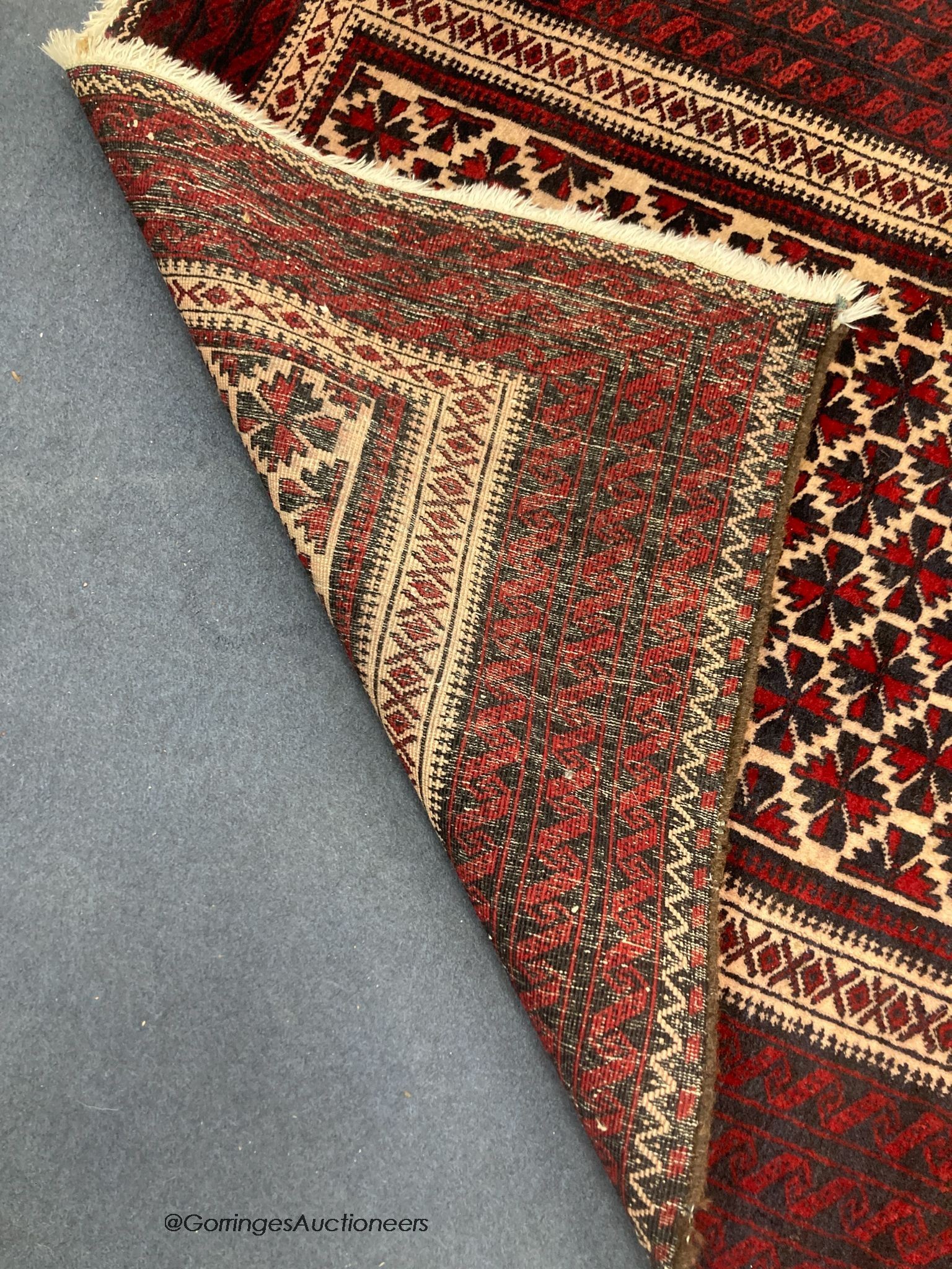 A Belouch wool rug, 194 x 105cm