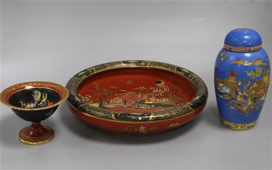 Two Carlton ware Temple and Mikado pattern red ground dishes and a similar blue ground jar and cover (3) largest diameter 28cm Two Carlton ware Temple and Mikado pattern red ground dishes and a similar blue ground jar and cover (3) largest diameter 28cm
