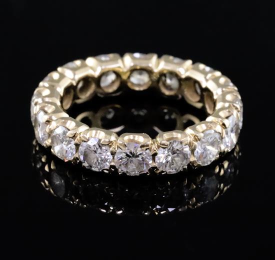 A gold and diamond full eternity ring, size K. A gold and diamond full eternity ring, size K.