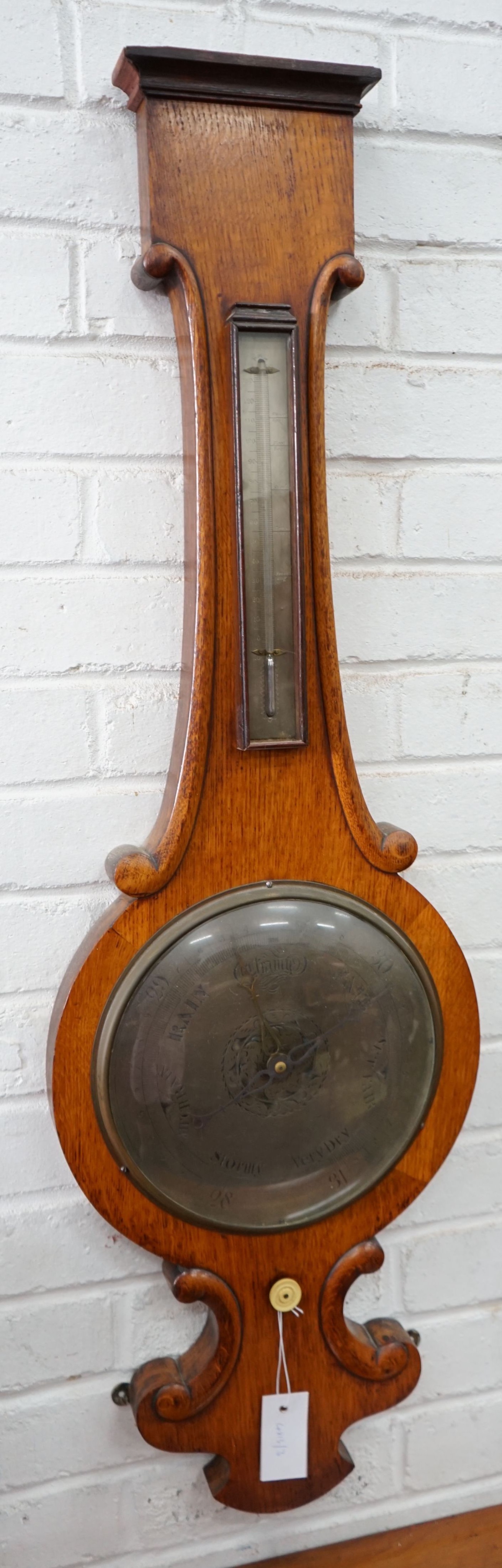 A Victorian oak wheel barometer, height 104cm