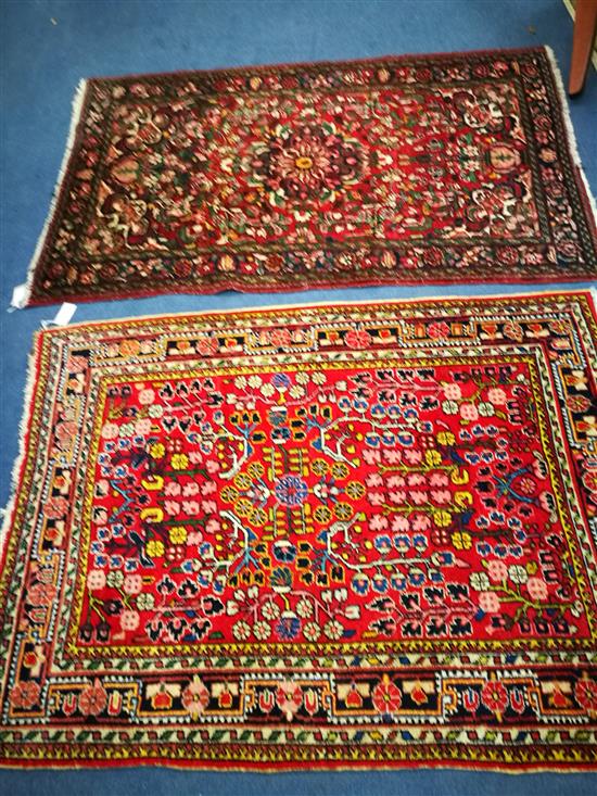 Two Persian red ground rugs W148cm x 105cm and 164cm x 105cm Two Persian red ground rugs W148cm x 105cm and 164cm x 105cm