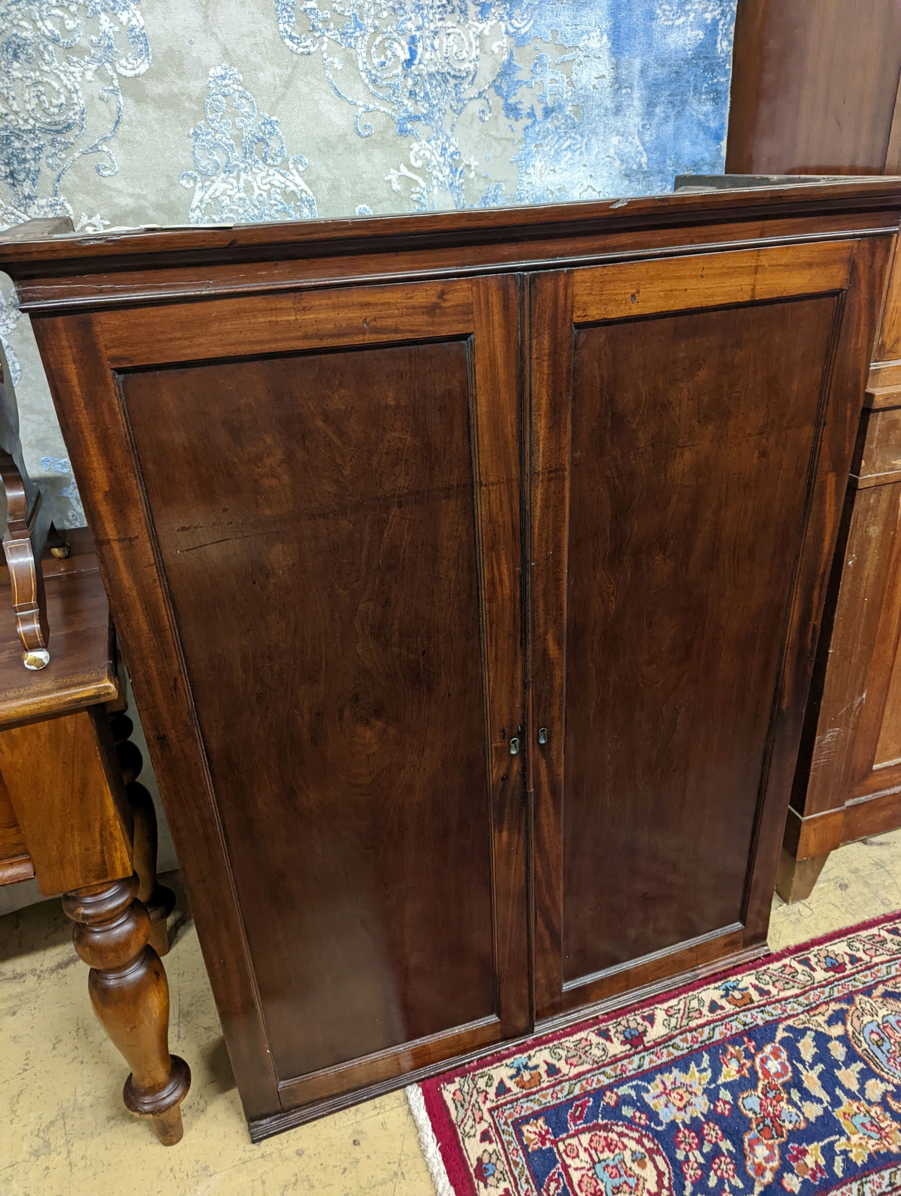 An early 19th century mahogany two door cabinet top section with pigeonhole interior, width 89cm, depth 42cm, height 113cm
