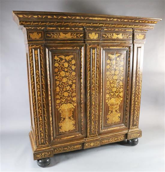 A 19th century Dutch walnut and marquetry armoire, W.6ft 3in. D.2ft 5in. H.6ft 4in. A 19th century Dutch walnut and marquetry armoire, W.6ft 3in. D.2ft 5in. H.6ft 4in.