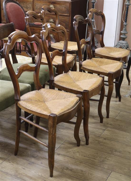 A set of six 19th century French stained beech rush seated dining chairs A set of six 19th century French stained beech rush seated dining chairs