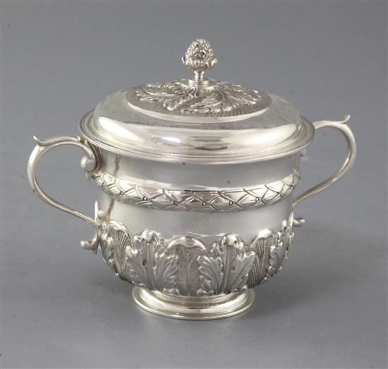 A George V 18th century style silver porringer and cover by Thomas of New Bond Street, 10 oz. A George V 18th century style silver porringer and cover by Thomas of New Bond Street, 10 oz.