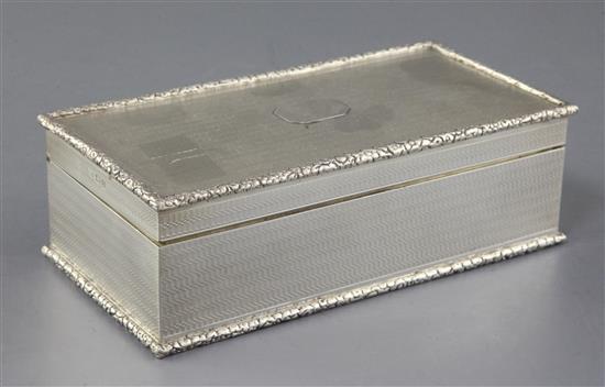 A George V engine turned silver rectangular cigarette box, retailed by Asprey & Co, A George V engine turned silver rectangular cigarette box, retailed by Asprey & Co,
