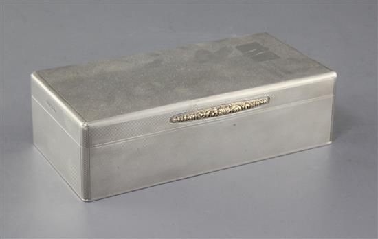 A 1930s engine turned silver rectangular cigarette box by Padgett & Braham Ltd, 17.8cm. A 1930s engine turned silver rectangular cigarette box by Padgett & Braham Ltd, 17.8cm.