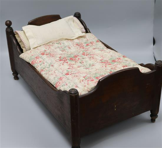 A dolls crib with bedding length 49cm A dolls crib with bedding length 49cm