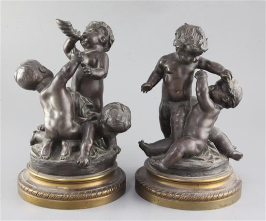 A pair of 19th century bronze groups of wrestling putti, height 10.75in. A pair of 19th century bronze groups of wrestling putti, height 10.75in.