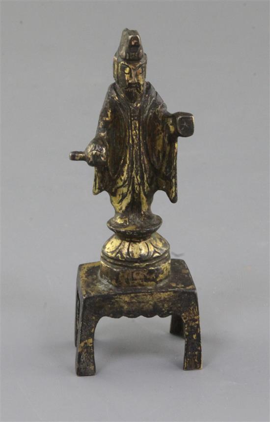 A small Chinese gilt bronze figure of a Daoist deity possibly Yuanshi Tianzun, Tang dynasty (AD 618-907), h. 11cm A small Chinese gilt bronze figure of a Daoist deity possibly Yuanshi Tianzun, Tang dynasty (AD 618-907), h. 11cm