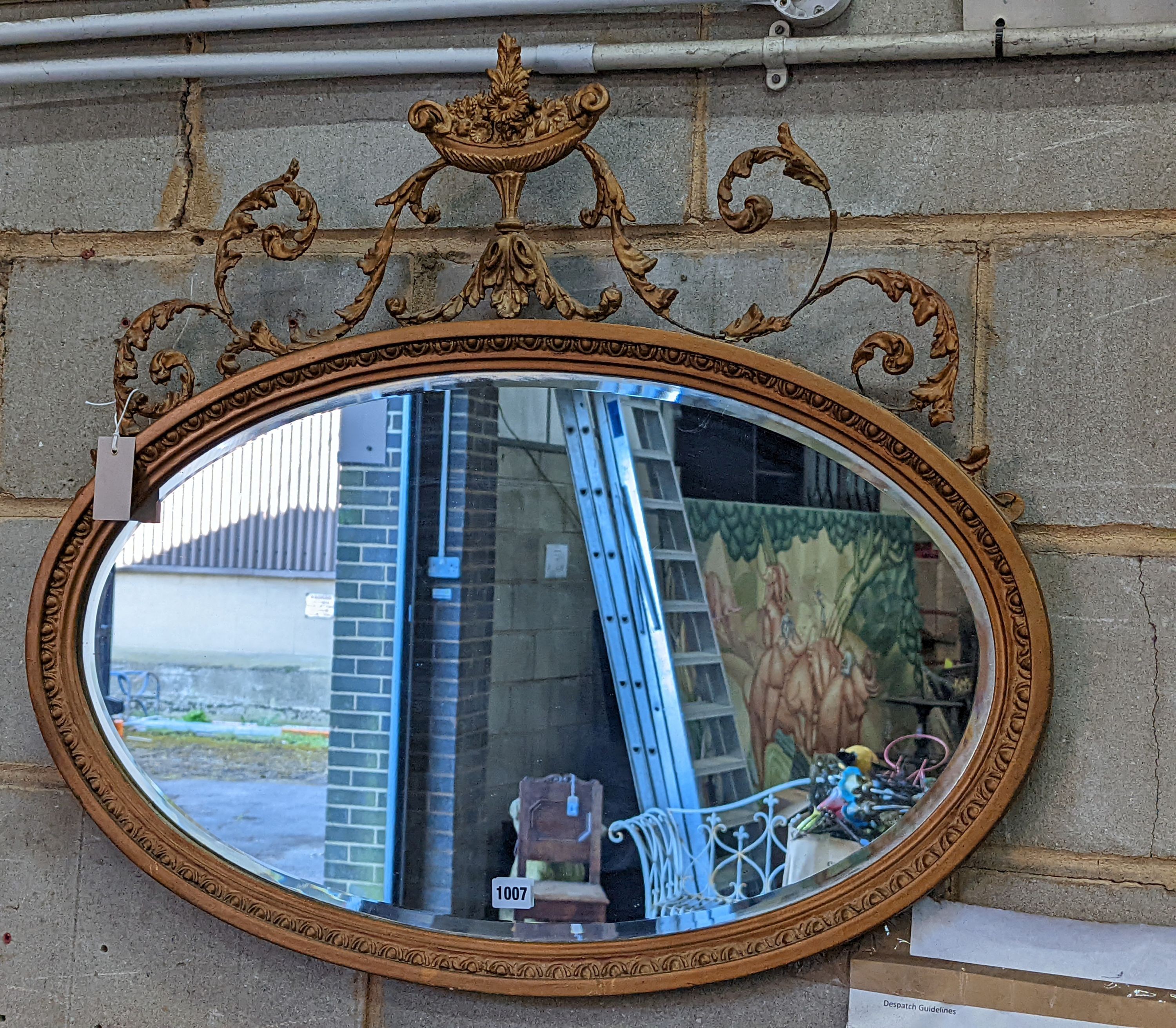 An Edwardian Adam design gilt framed oval mirror, width 82cm, height 74cm