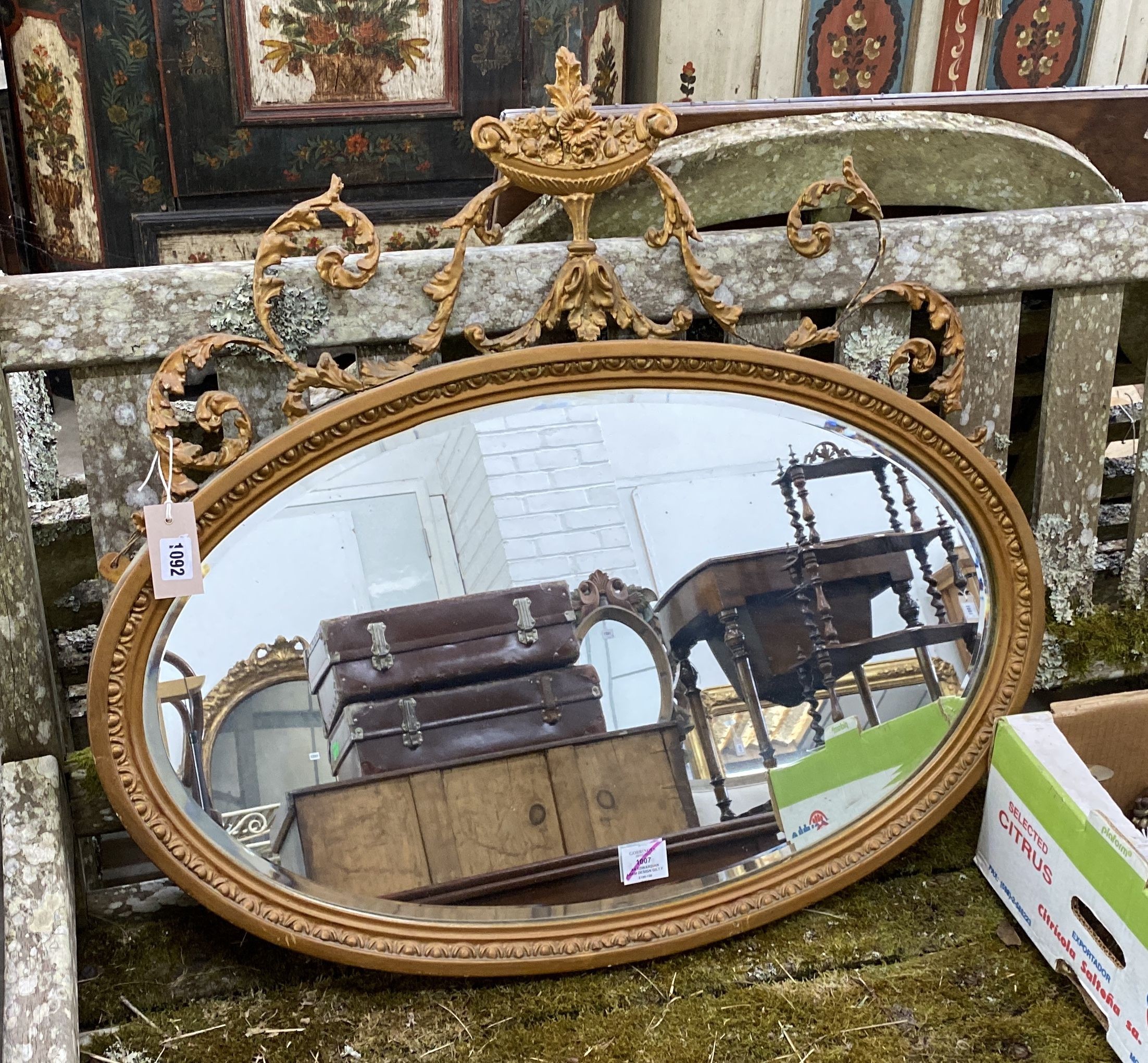 An Edwardian Adam design gilt framed oval mirror, width 82cm, height 74cm