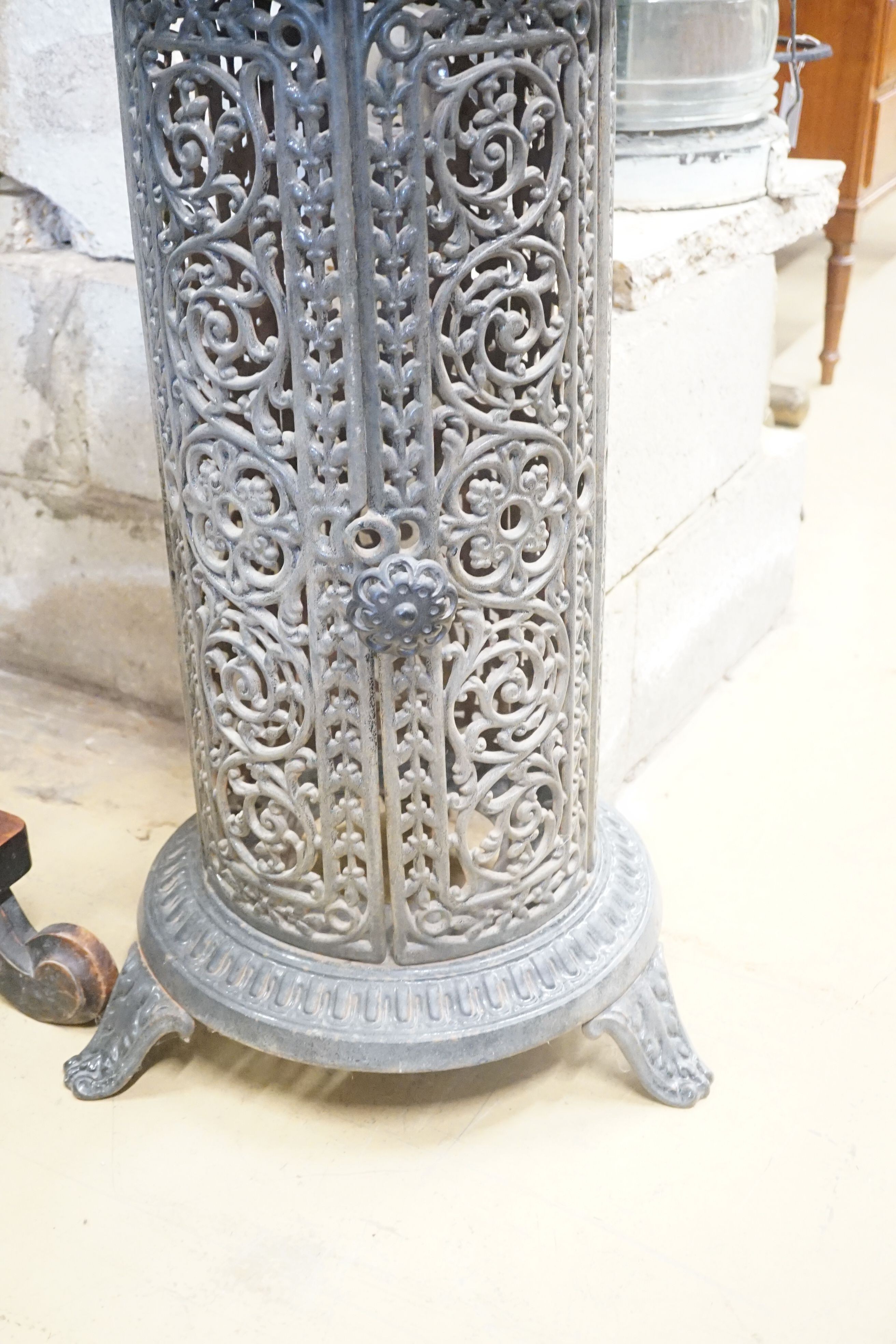 A French pierced enamel cylindrical cast iron conservatory heater, height 110cm