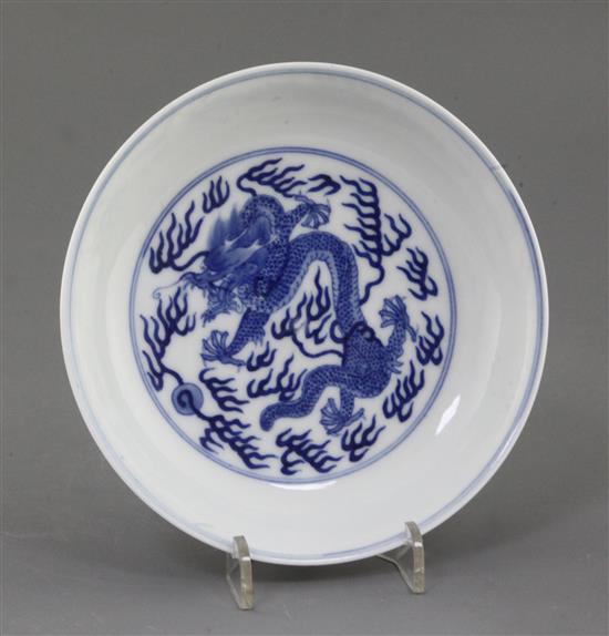 A Chinese blue and white dragon dish, diameter 16.3cm, some damage A Chinese blue and white dragon dish, diameter 16.3cm, some damage