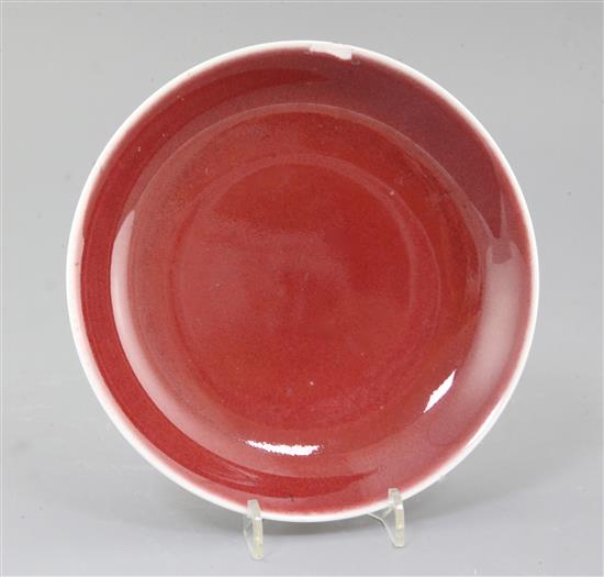 A Chinese sang de boeuf dish, Qianlong mark and probably of the period (1736-1795), diameter 19cm, rim chip A Chinese sang de boeuf dish, Qianlong mark and probably of the period (1736-1795), diameter 19cm, rim chip