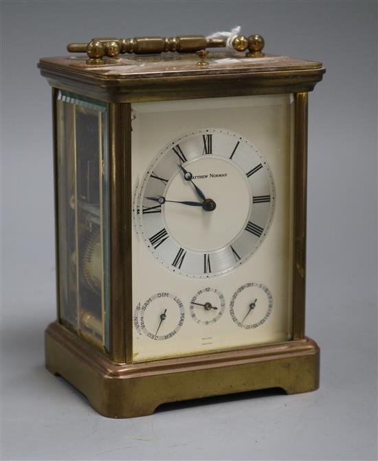 A Matthew Norman gilt brass carriage clock with calendar dials and push repeat A Matthew Norman gilt brass carriage clock with calendar dials and push repeat