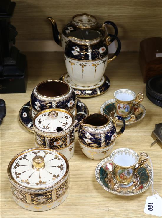 An Imari lustre pottery breakfast set and a pair of Vienna style cabinet coffee cups and saucers
