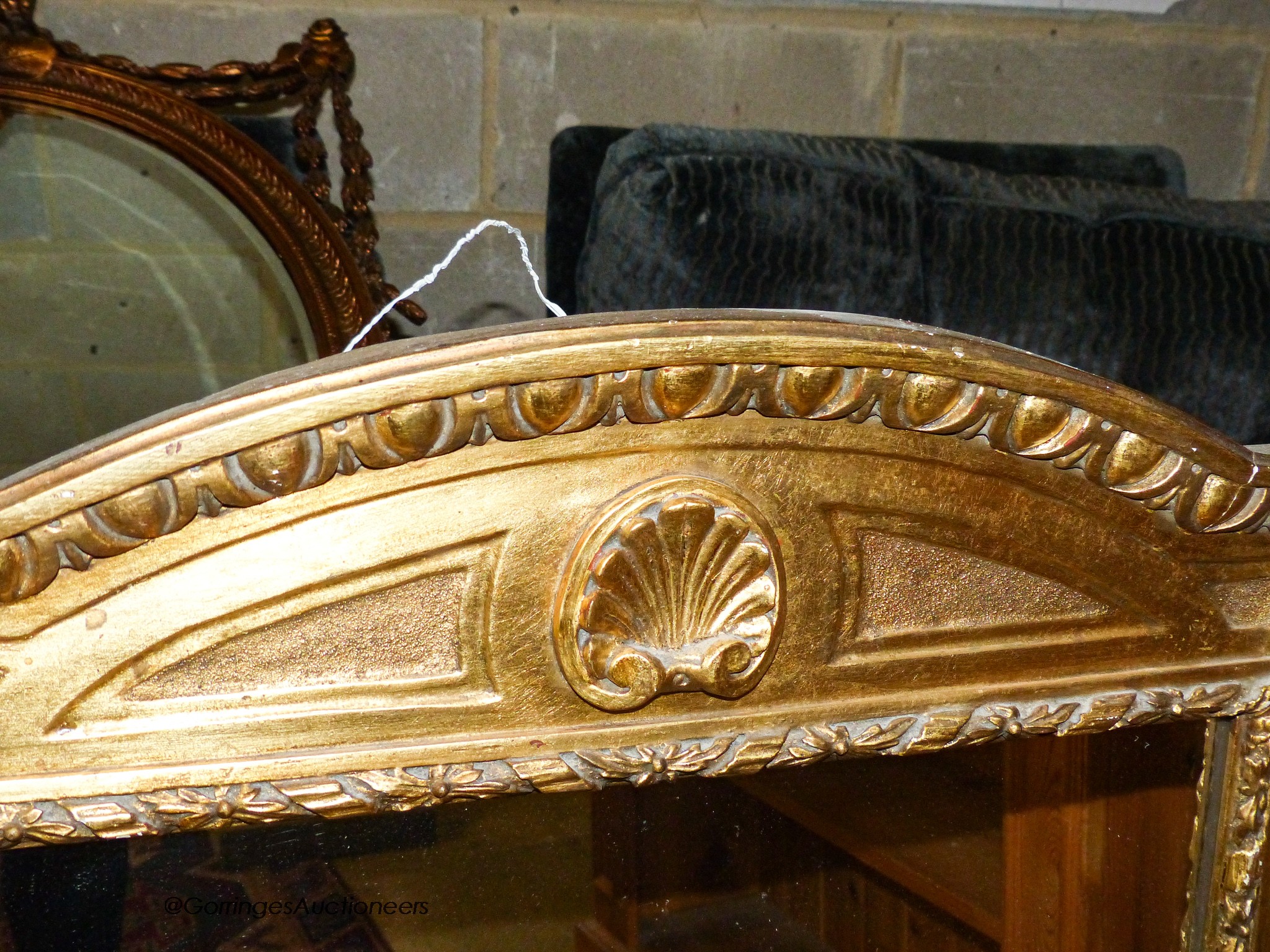 A gilt composition wall mirror in 18th century style