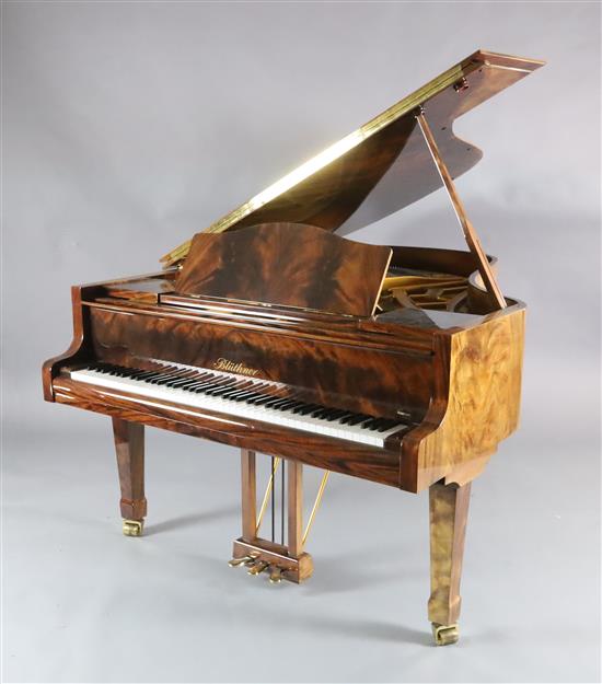 A Bluthner Model 6 flame mahogany cased grand piano, W.4ft 10in. L.6ft 3in. H.3ft 3in. A Bluthner Model 6 flame mahogany cased grand piano, W.4ft 10in. L.6ft 3in. H.3ft 3in.