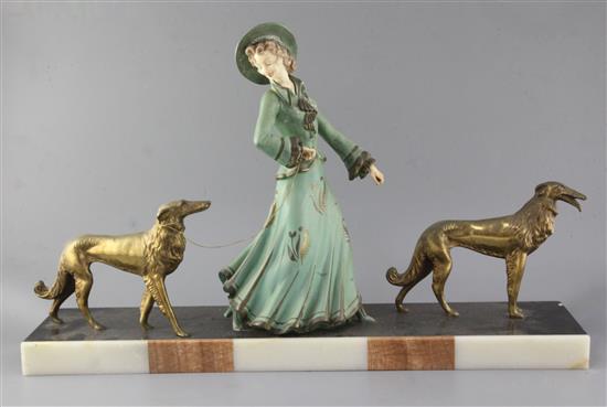 George Maxim (1895-1940). A French Art Deco painted and gilt spelter group of an elegant lady and two borzois, 26.5in. George Maxim (1895-1940). A French Art Deco painted and gilt spelter group of an elegant lady and two borzois, 26.5in.