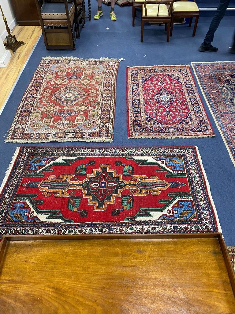 Three North West Persian rugs, largest 180 x 120cm