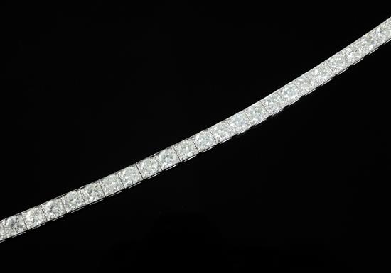 An attractive modern 18ct white gold and diamond line bracelet, 18cm. An attractive modern 18ct white gold and diamond line bracelet, 18cm.