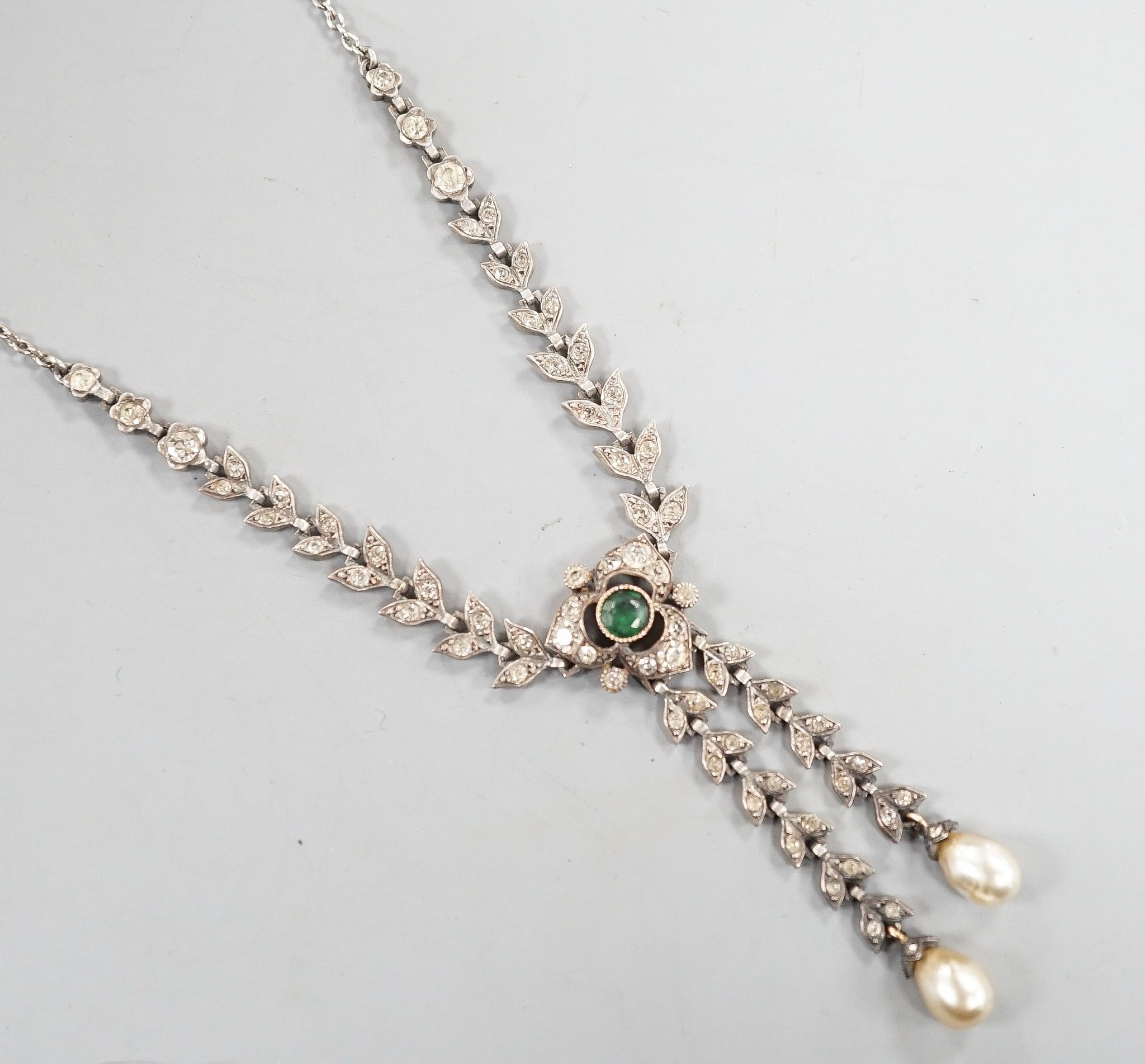 An antique white metal, two colour paste and simulated pearl set drop pendant necklace, 47cm.