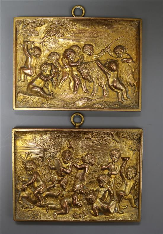 Two gilt metal putti plaques 11 x 15cm