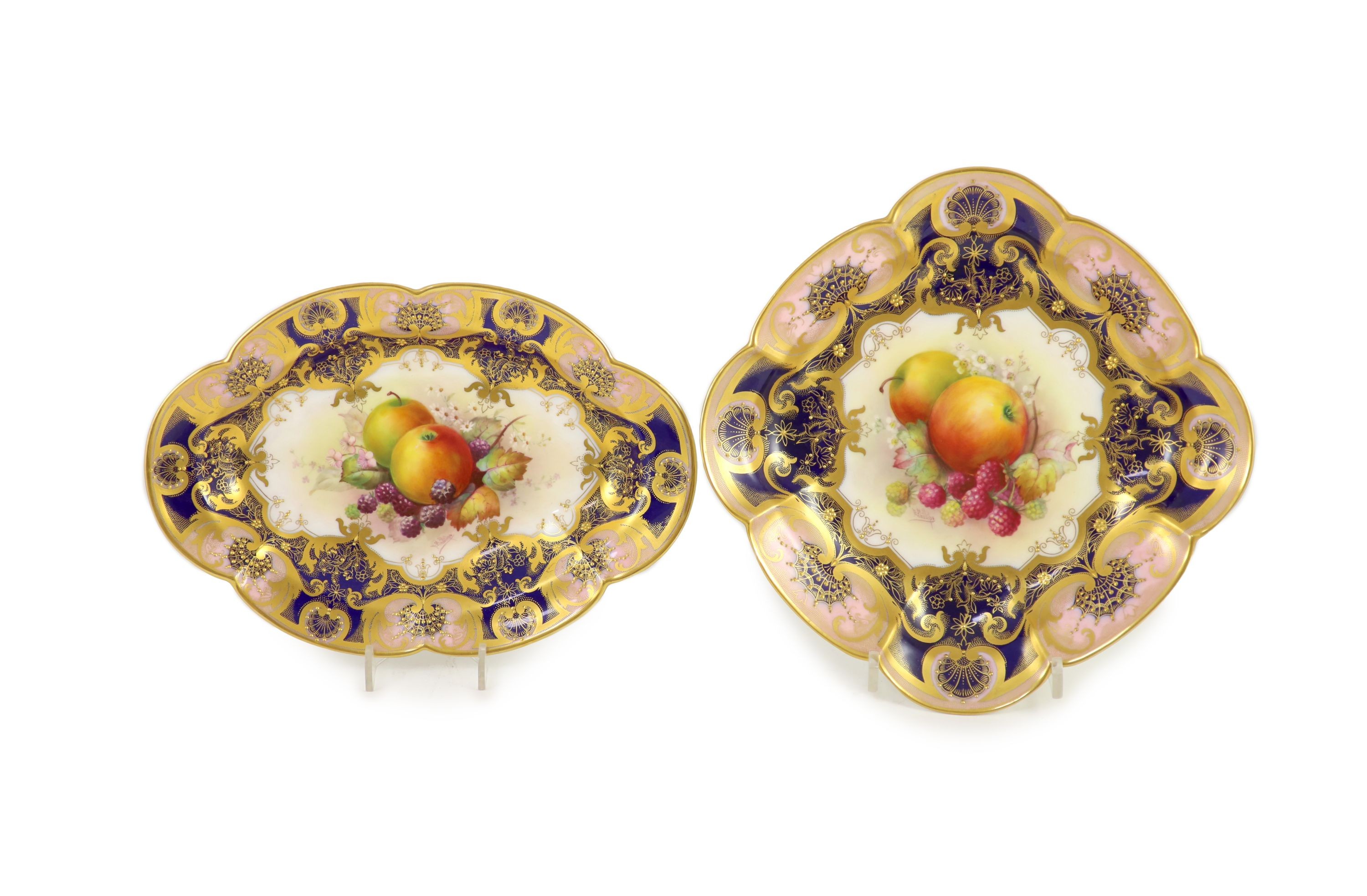 Two Royal Worcester fruit painted dessert dishes, signed E. Phillips, c.1918, 24cm and 27.5cm